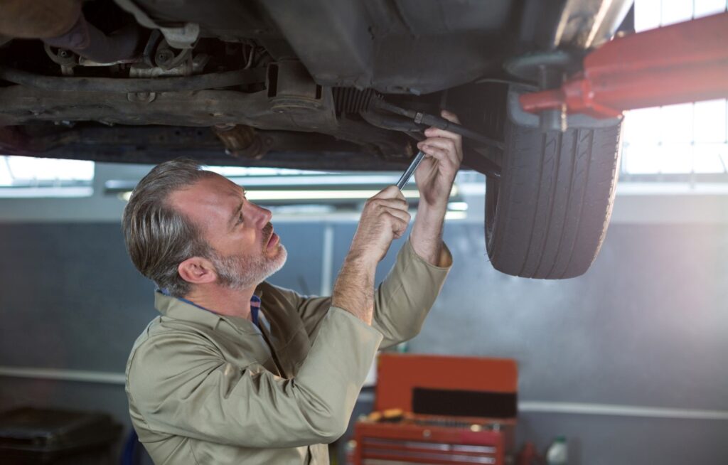 Mechanic working on sport exhausts