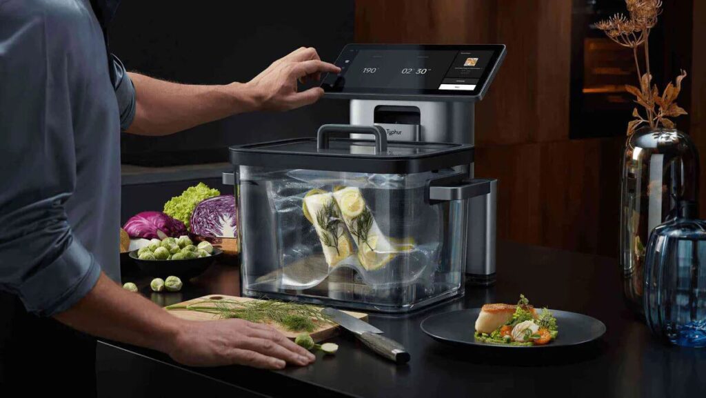 A man operating a kitchen equipment
